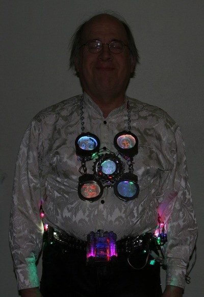 Model Wearing Led Art Handcuff Necklace And Sunrise Belt Buckle On Bicycle Chain Belt